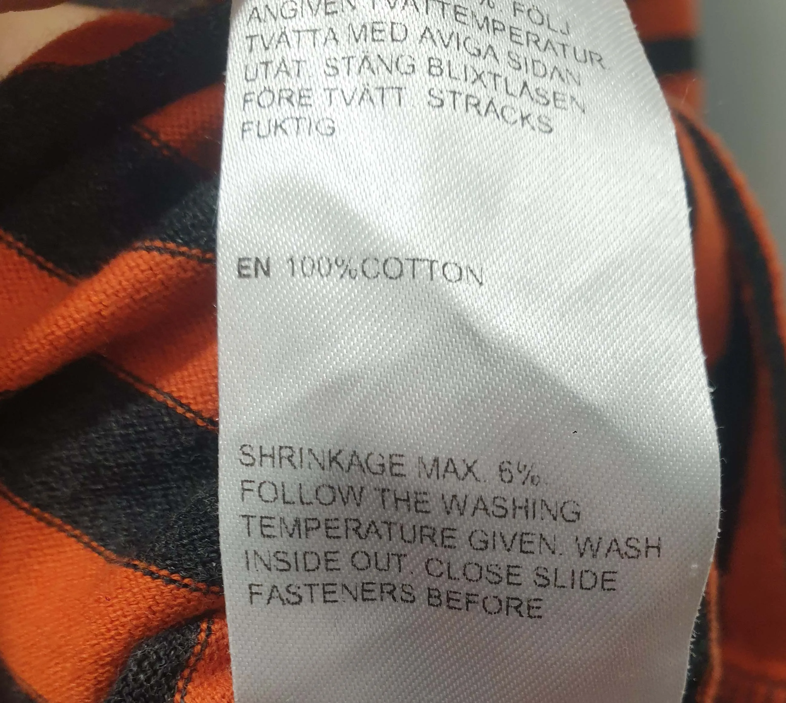 Marimekko orange and black long sleeve top size L, best fits 12-14